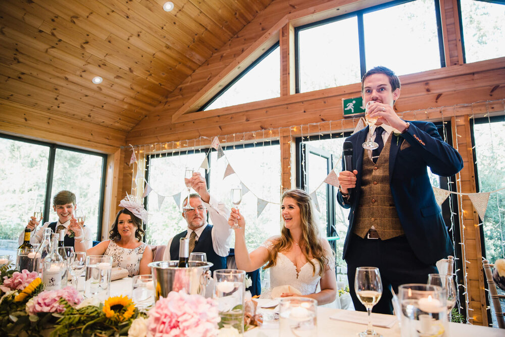 grooms speech and raising glasses