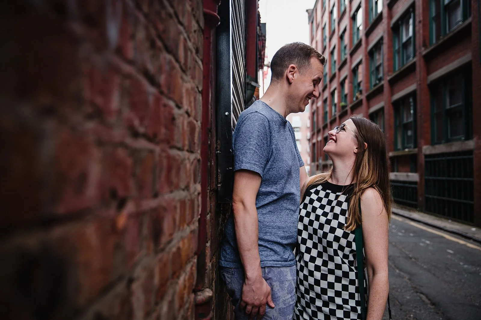 stevenson-square-northern-quarter-couple-brick-wall-portrait.jpg