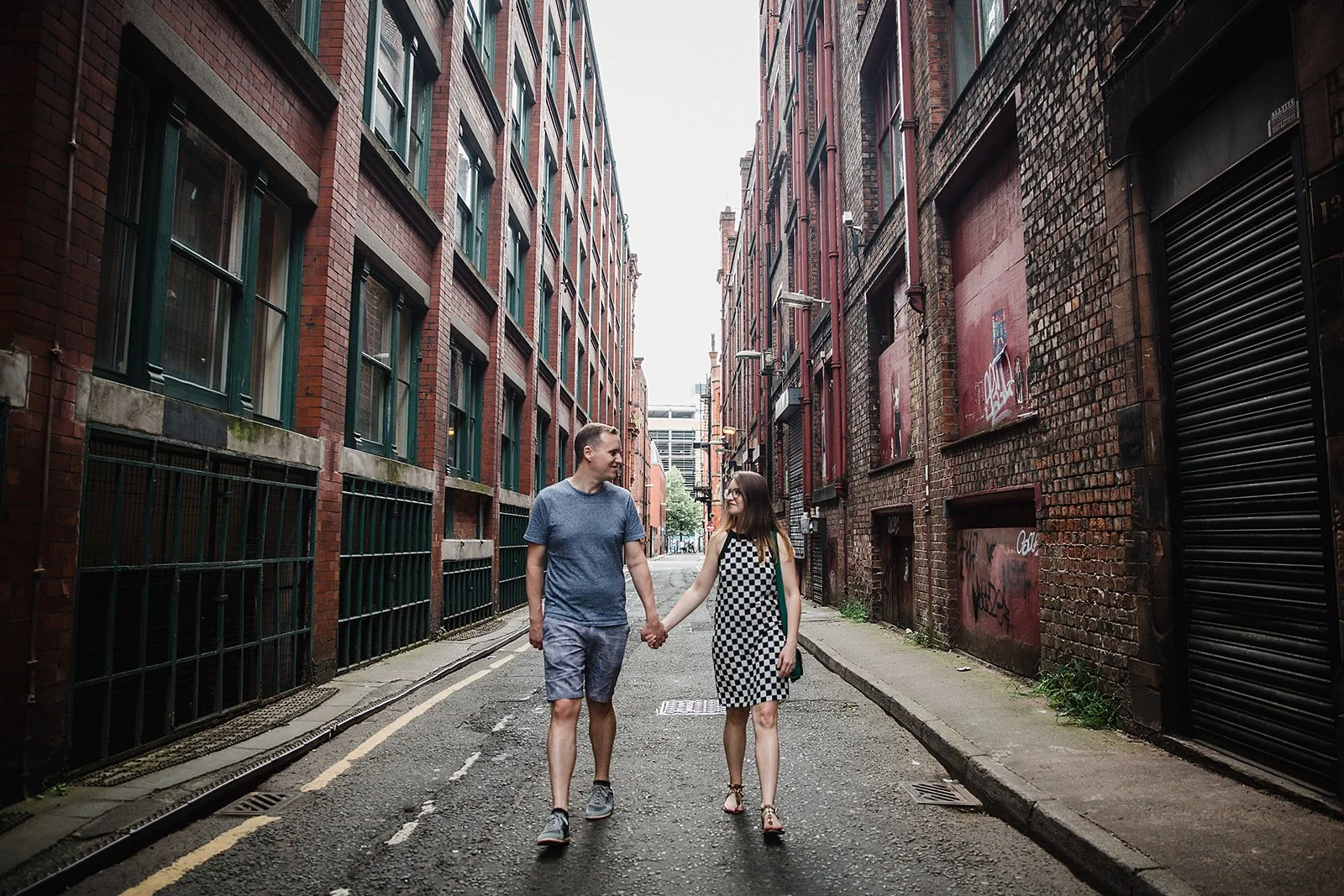 stevenson-square-northern-quarter-couple-walking-brick-street.jpg