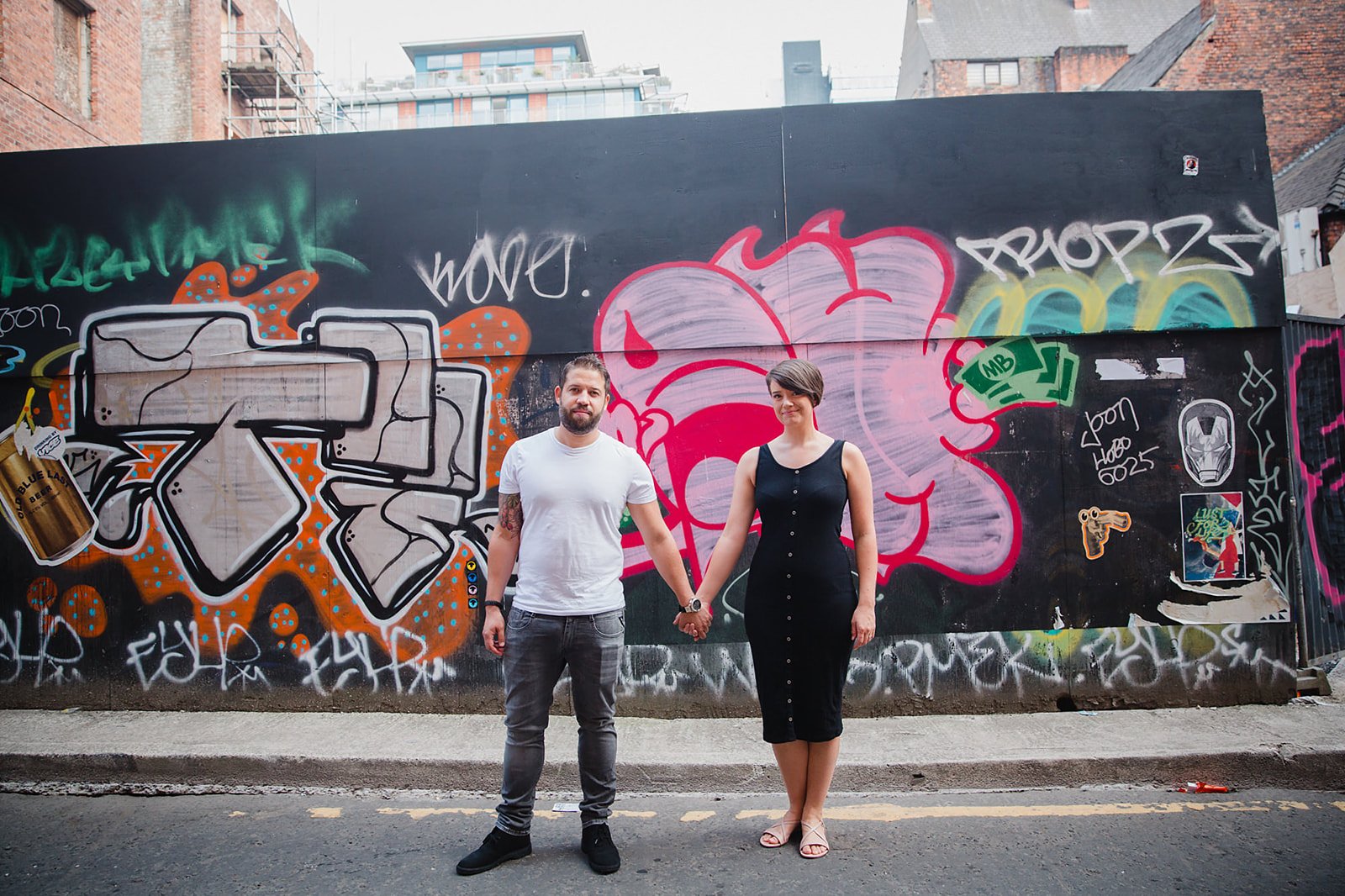 stevenson-square-northern-quarter-couple-graffiti-wall-holding-hands.jpg