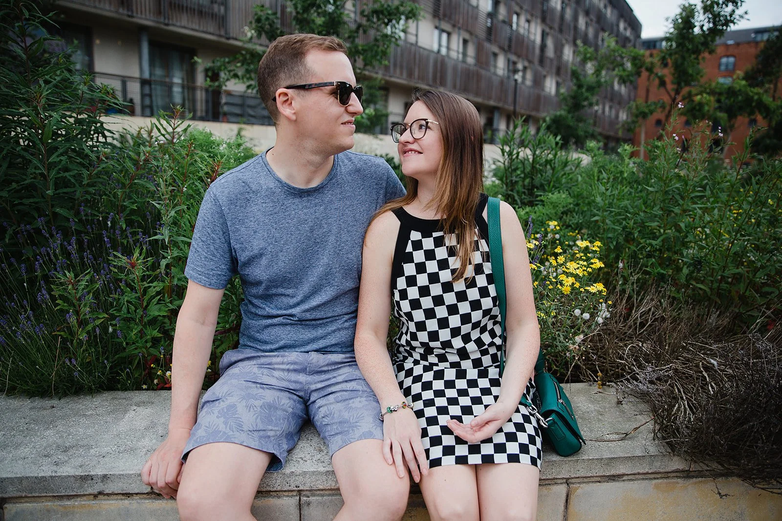 stevenson-square-northern-quarter-couple-sitting-stone-bench-greenery.jpg