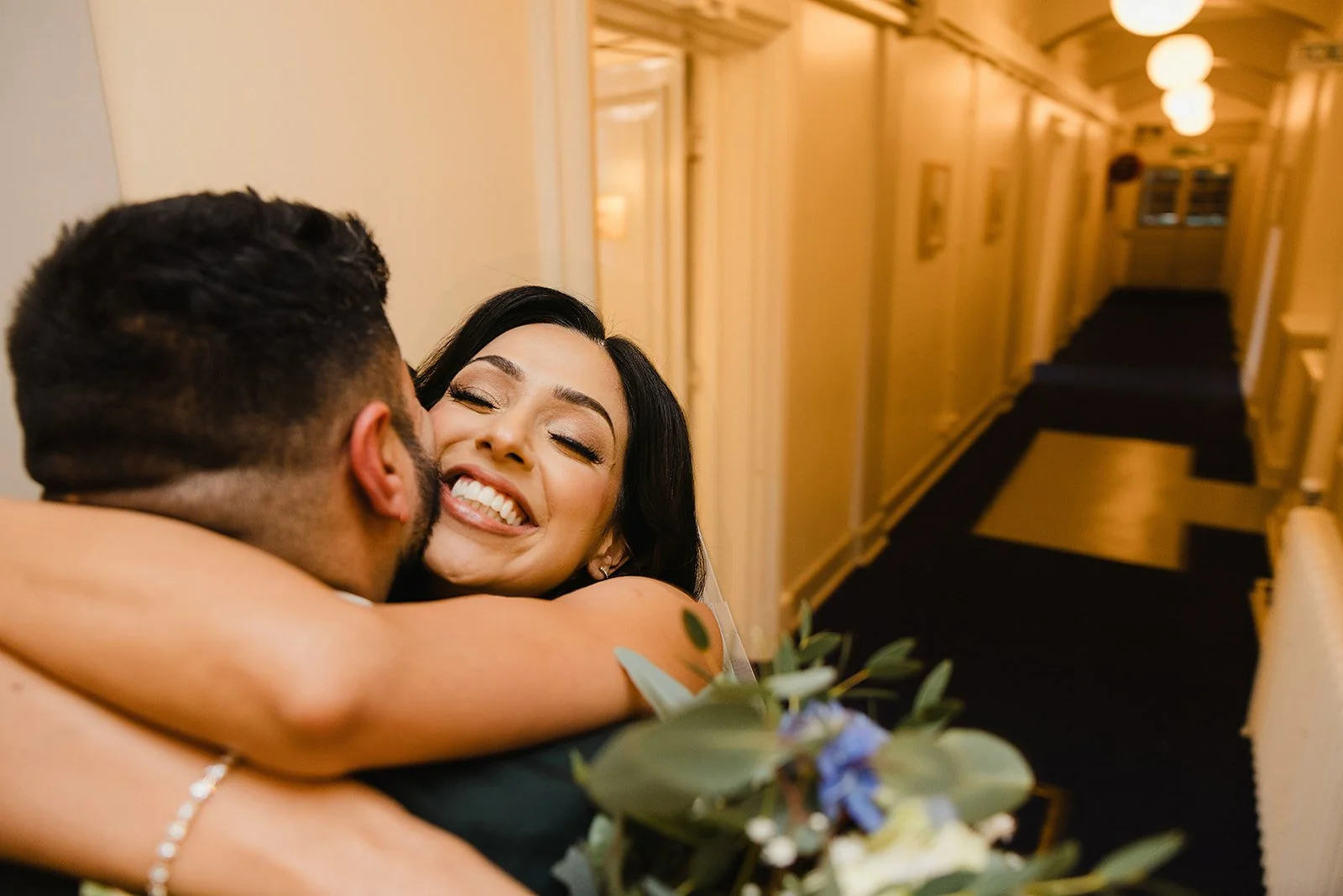 stockport-town-hall-wedding-emotional-hug-nikita-antash.jpg