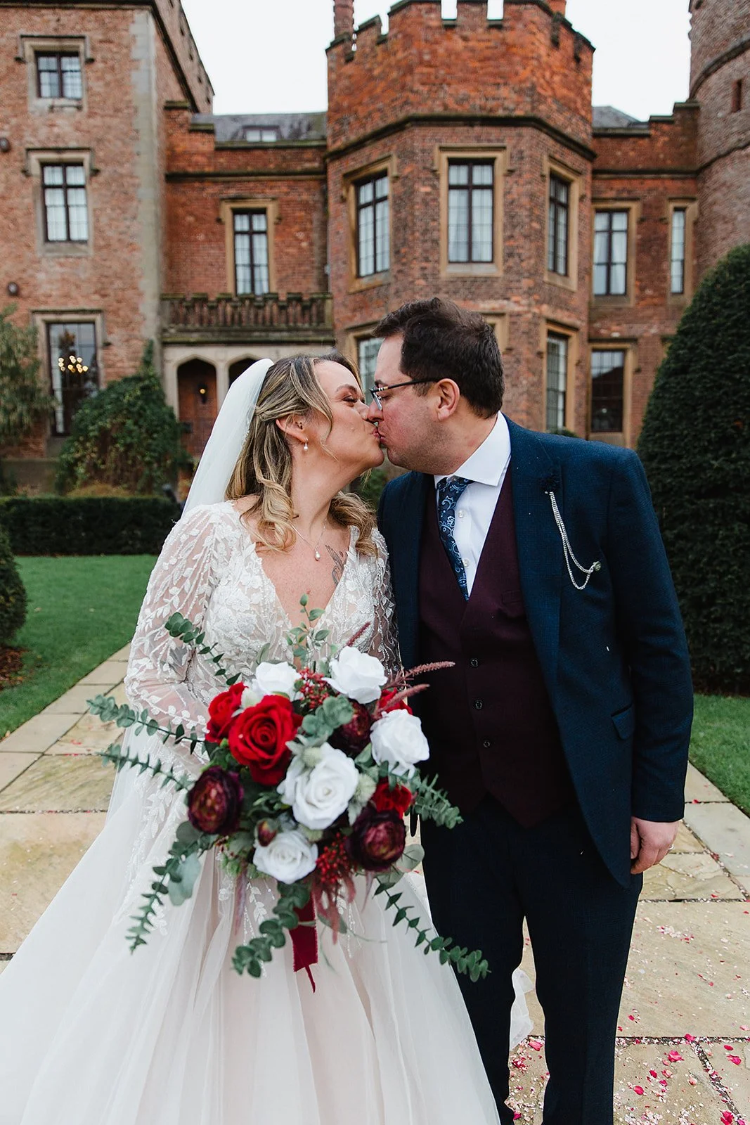 rowton-castle-wedding-couple-kiss-outdoors-jade-gus.jpg