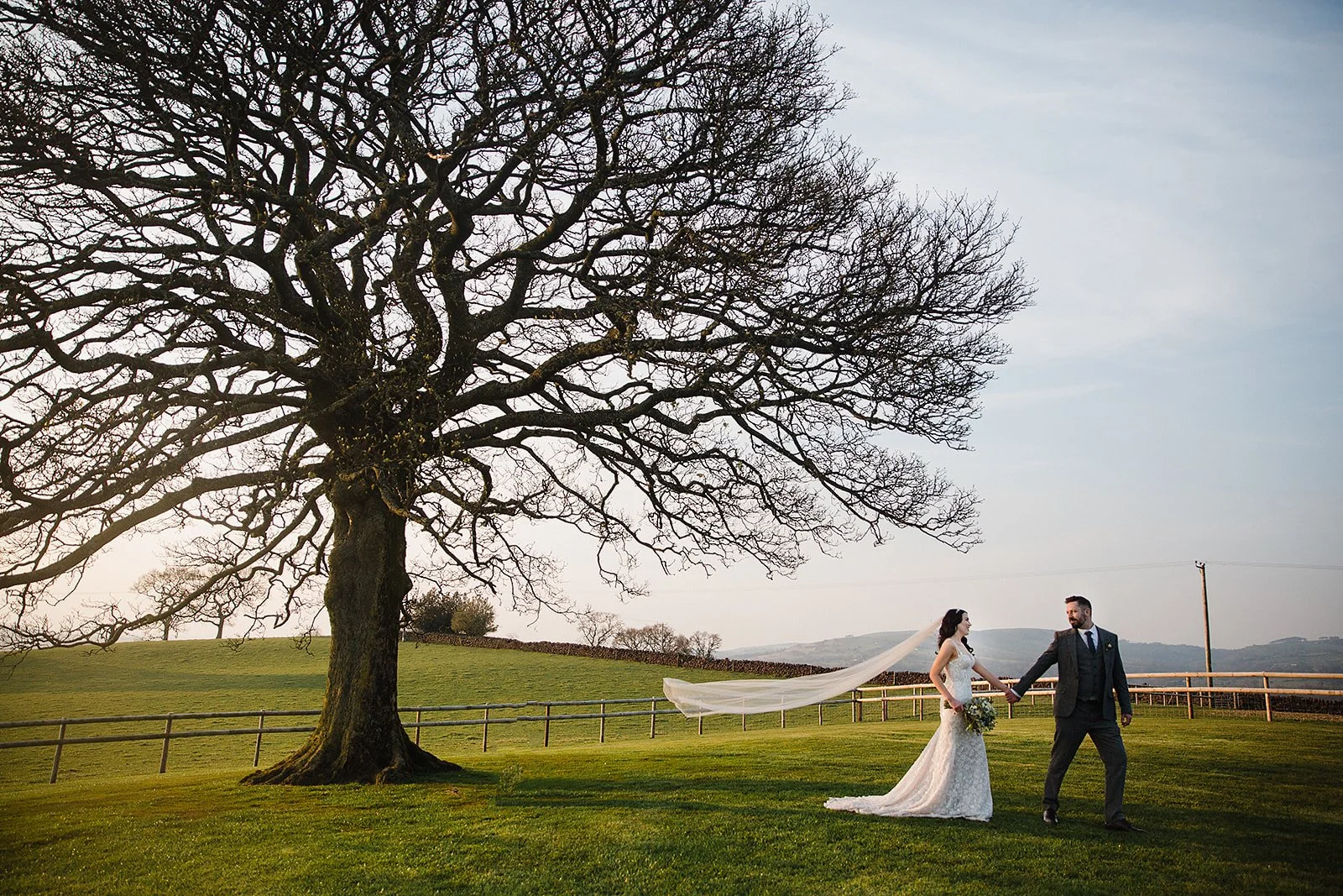 heaton-house-farm-wedding-couple-walk-sycamore-tree.jpg