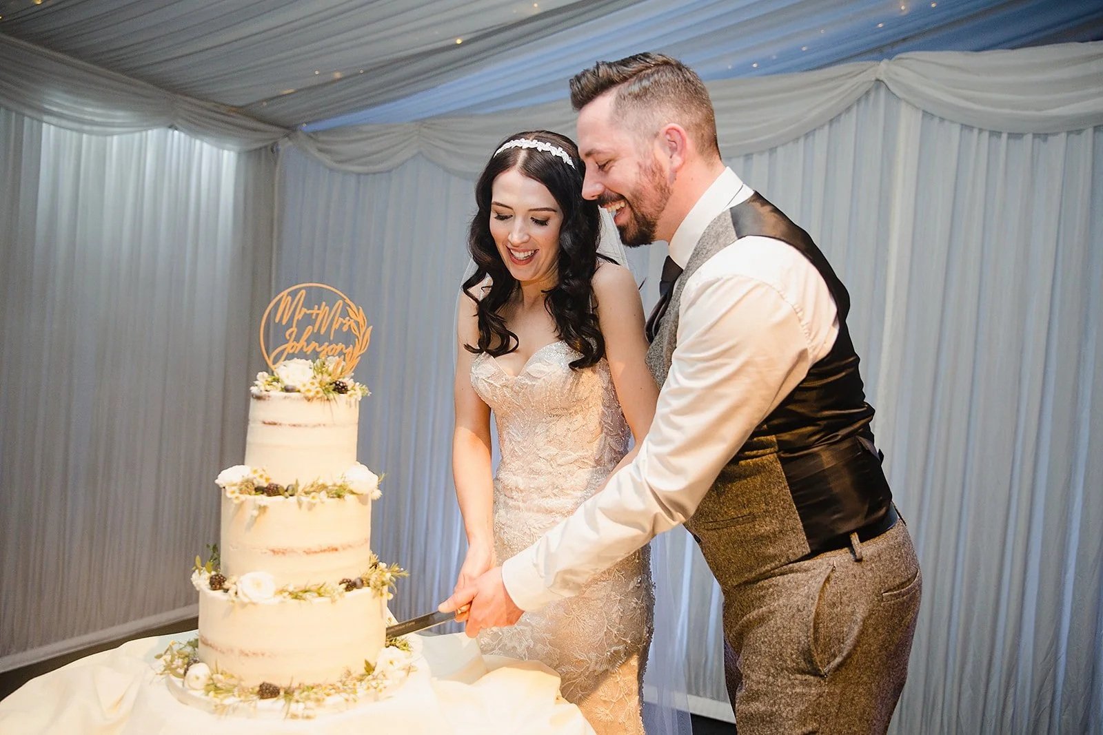heaton-house-farm-wedding-cake-cutting.jpg
