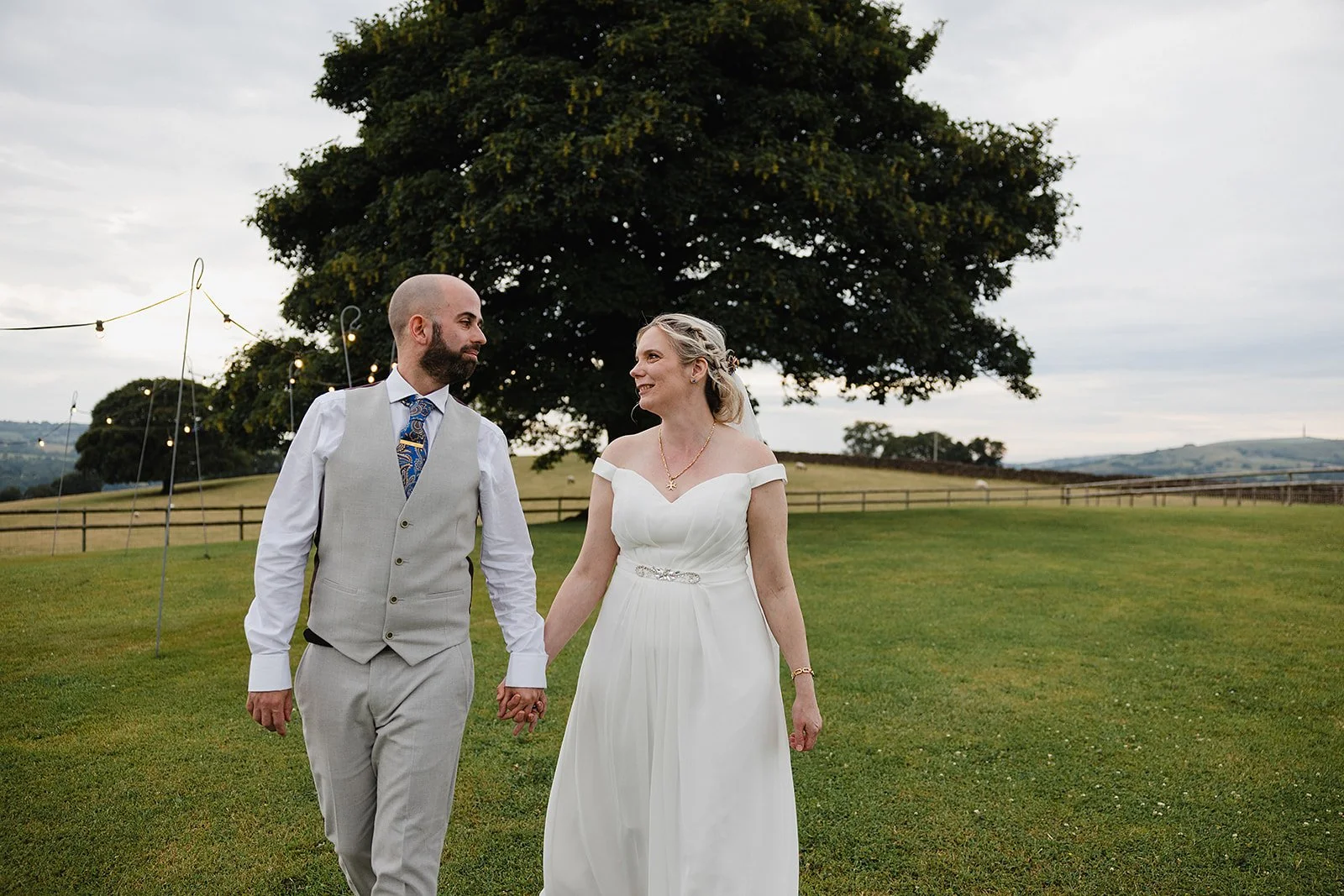 heaton-house-farm-wedding-couple-walk-sycamore-tree.jpg