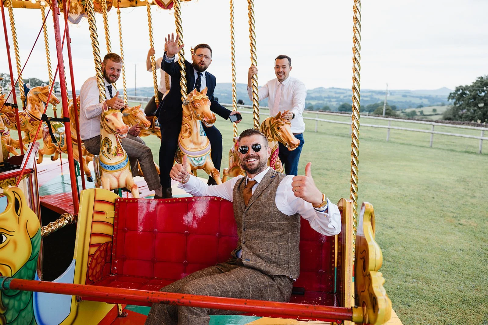 heaton-house-farm-wedding-guests-carousel-ride.jpg