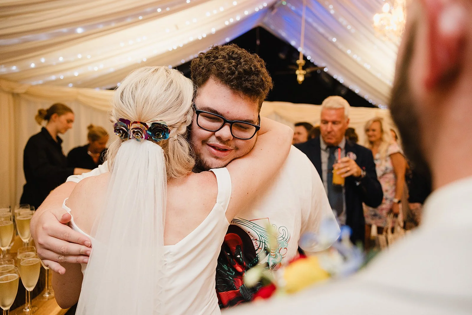 heaton-house-farm-wedding-bride-hugging-child.jpg