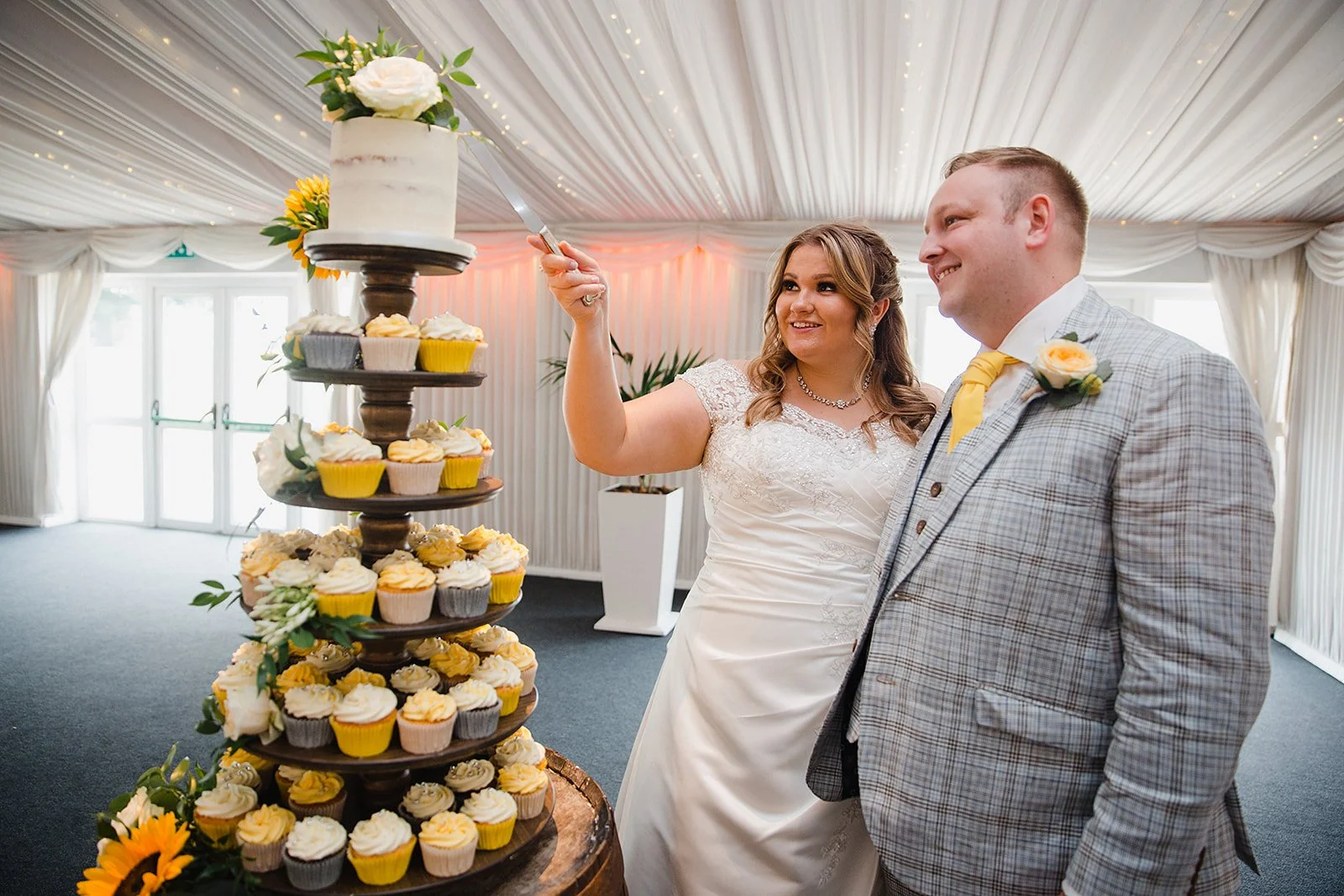 heaton-house-farm-wedding-cake-cutting-cupcake-tower.jpg