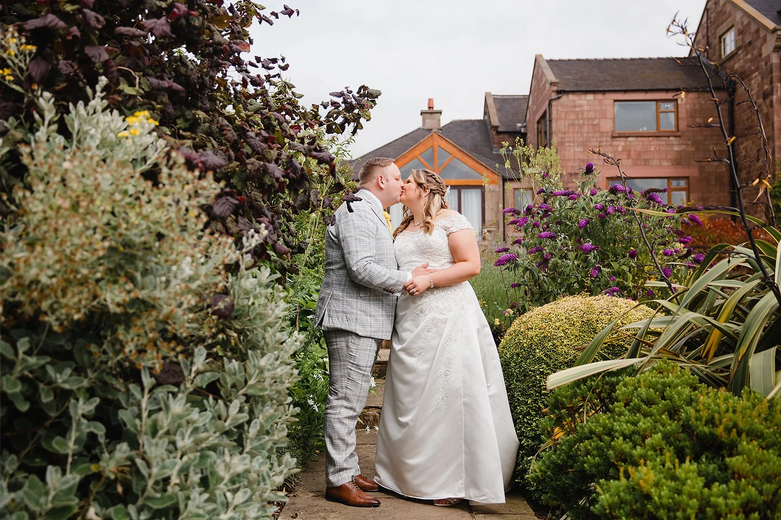heaton-house-farm-wedding-water-gardens-intimate-kiss.jpg