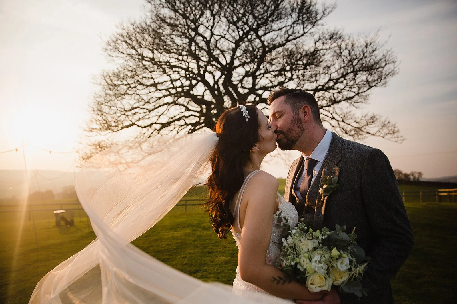 heaton-house-farm-wedding-golden-hour-sycamore-tree-kiss.jpg