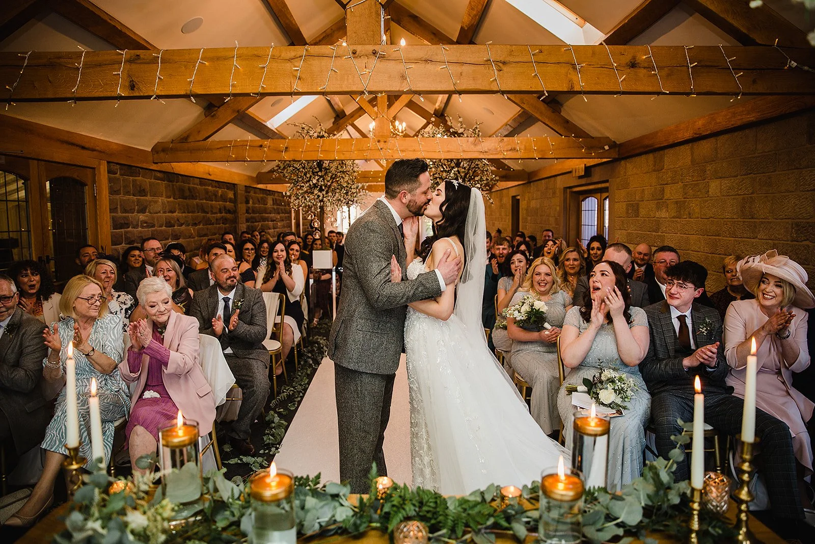 heaton-house-farm-stableyard-wedding-first-kiss.jpg