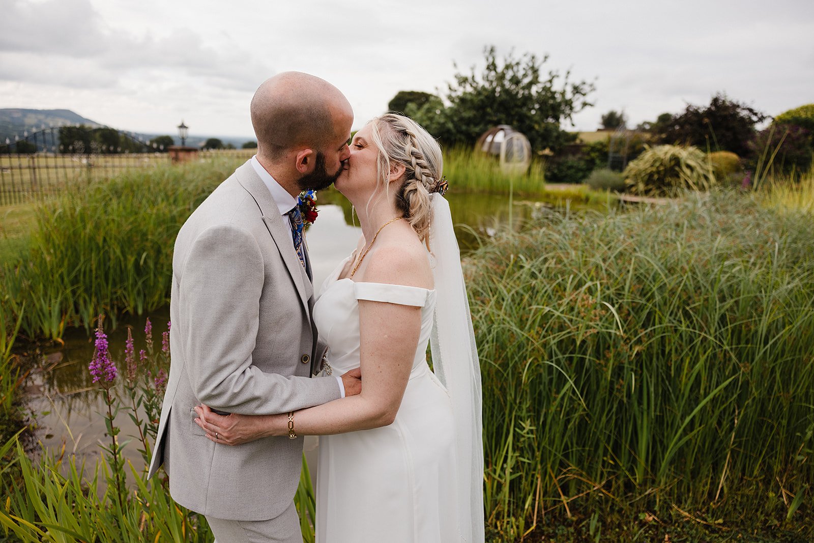 heaton-house-farm-wedding-water-gardens-kiss-portrait.jpg
