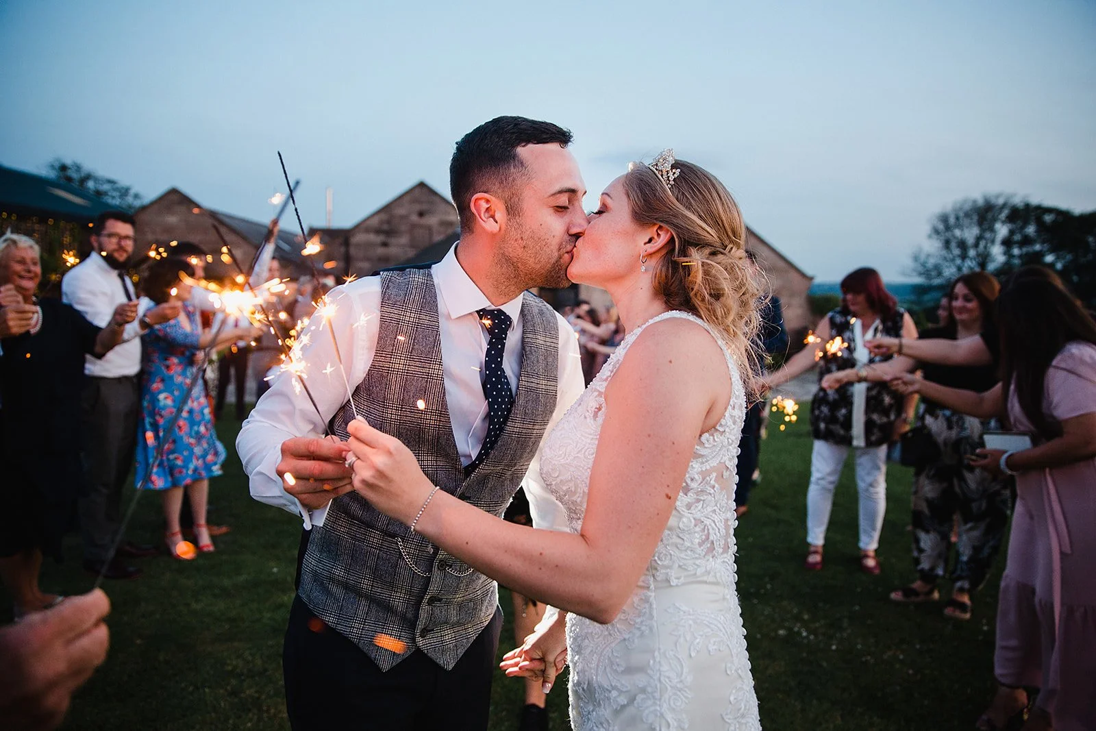 heaton-house-farm-sparkler-exit-couple-kiss.jpg
