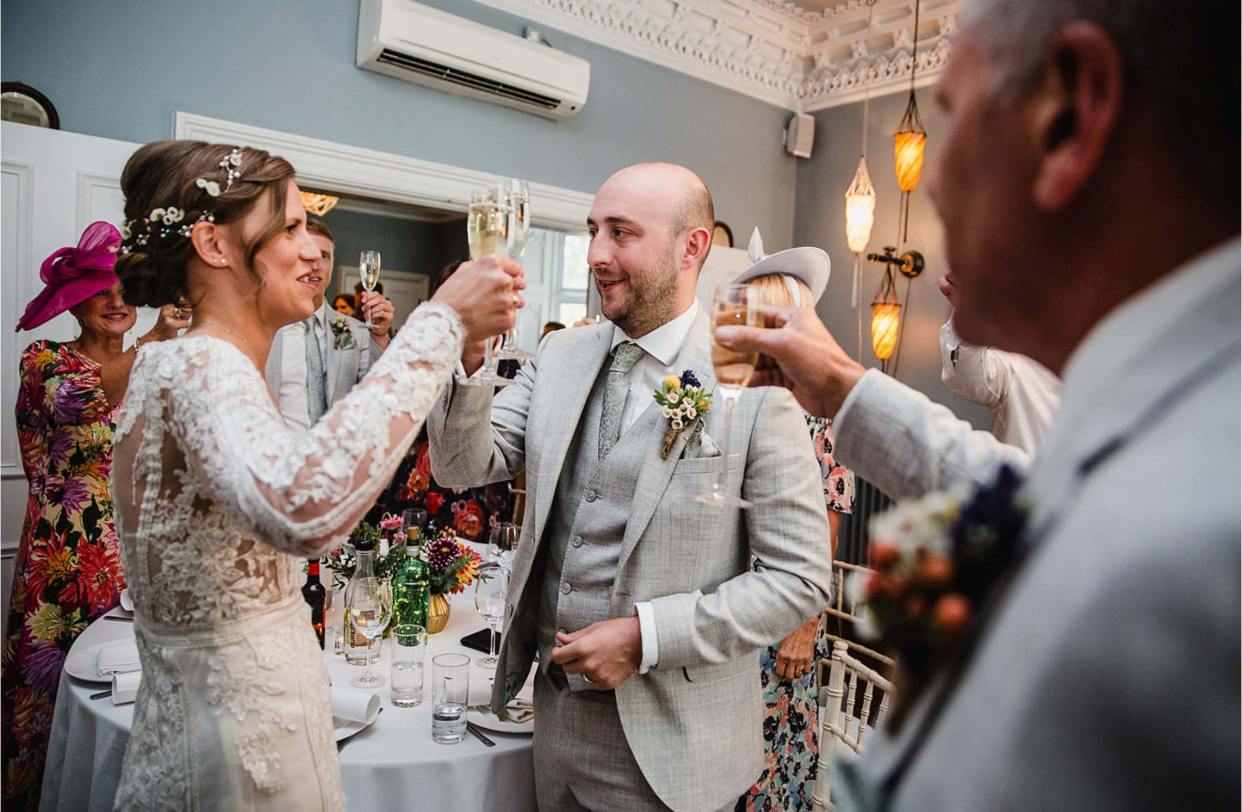 didsbury-house-hotel-blue-lounge-couple-toast.jpg