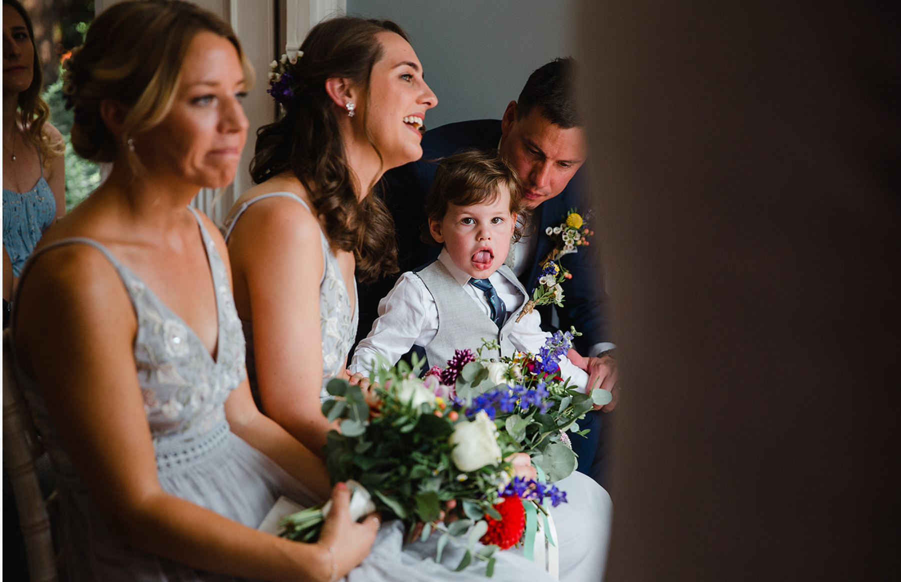 didsbury-house-hotel-blue-lounge-page-boy-tongue-out.jpg
