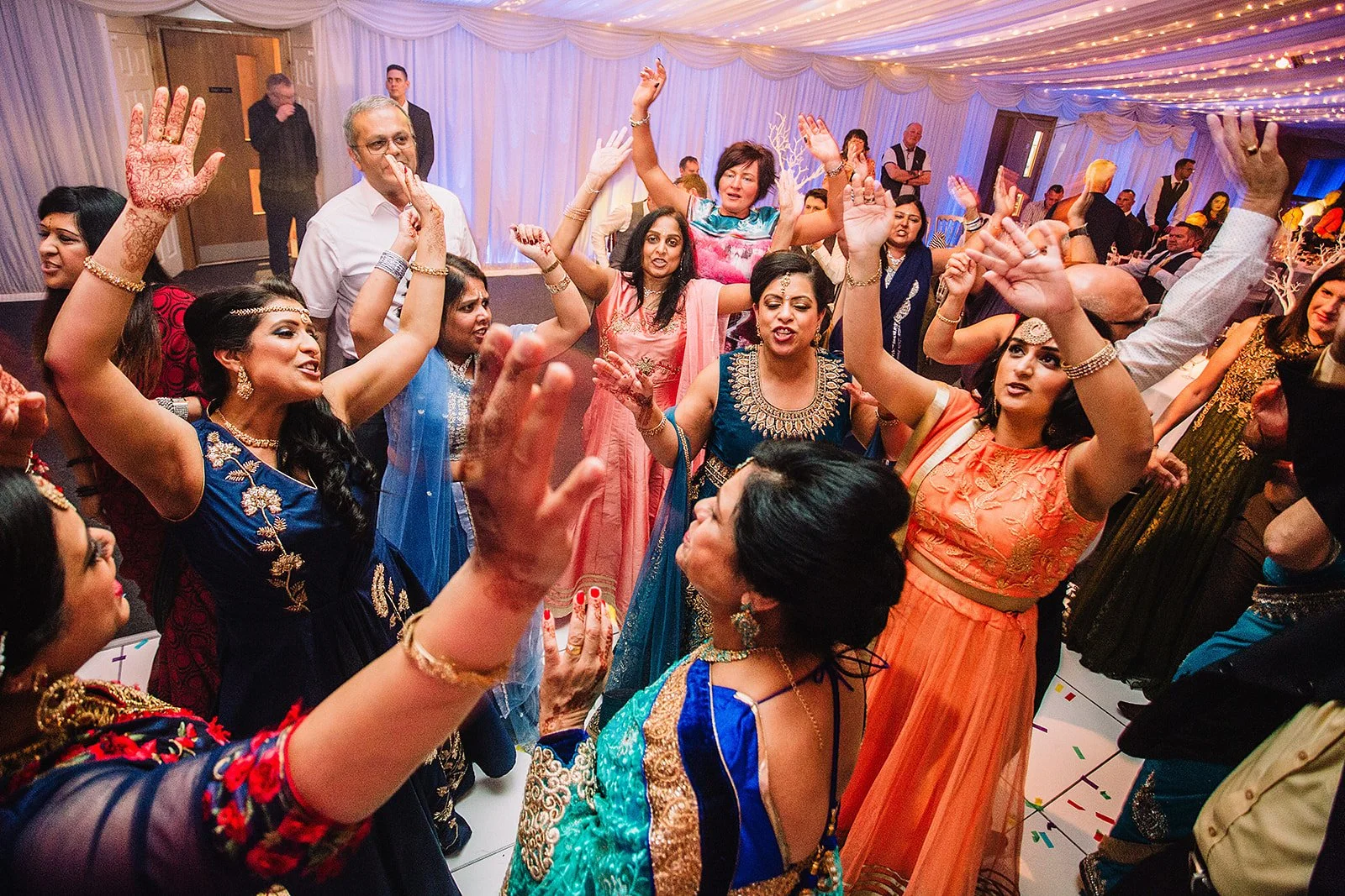 heaton-house-farm-indian-wedding-women-dancing-celebration.jpg  
