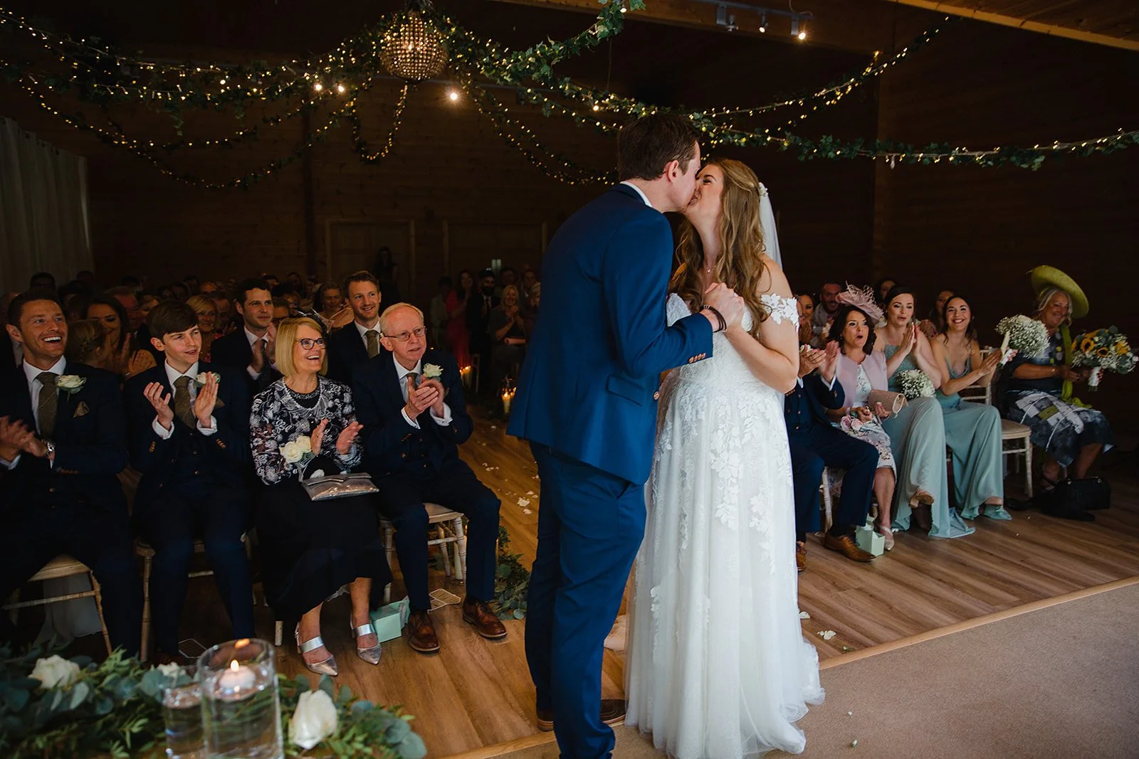 styal-lodge-wedding-photography-first-kiss-aisle.jpg
