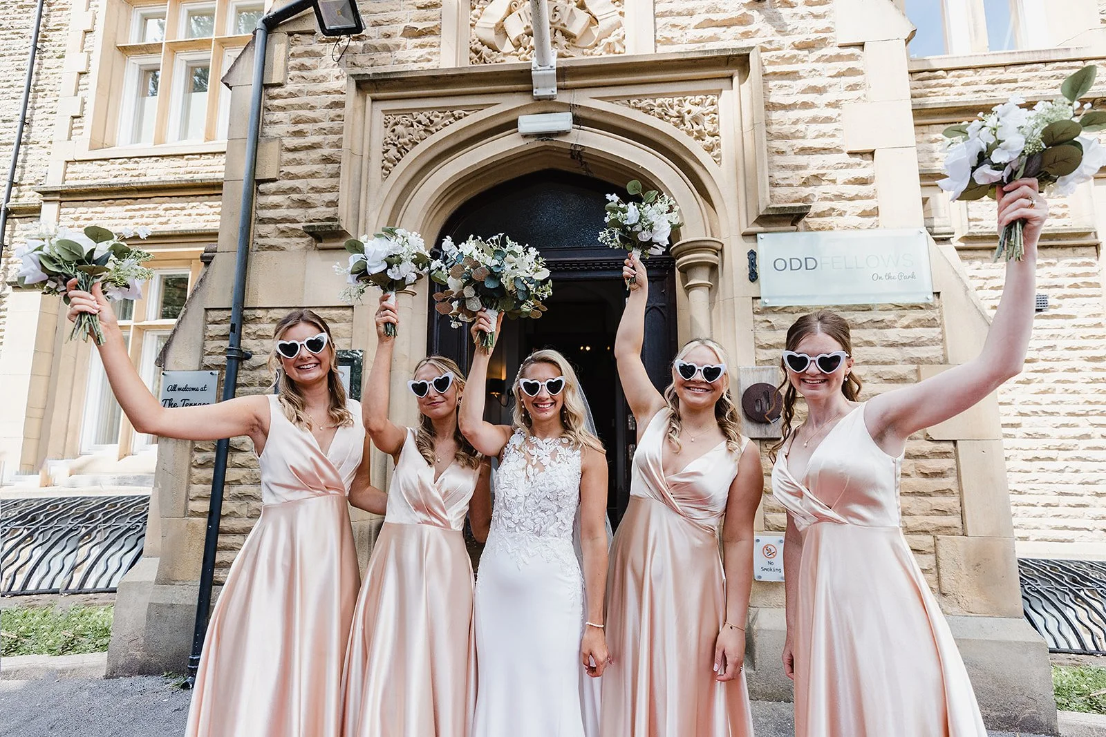 oddfellows-bridesmaids-pink-dresses-heart-sunglasses.jpg