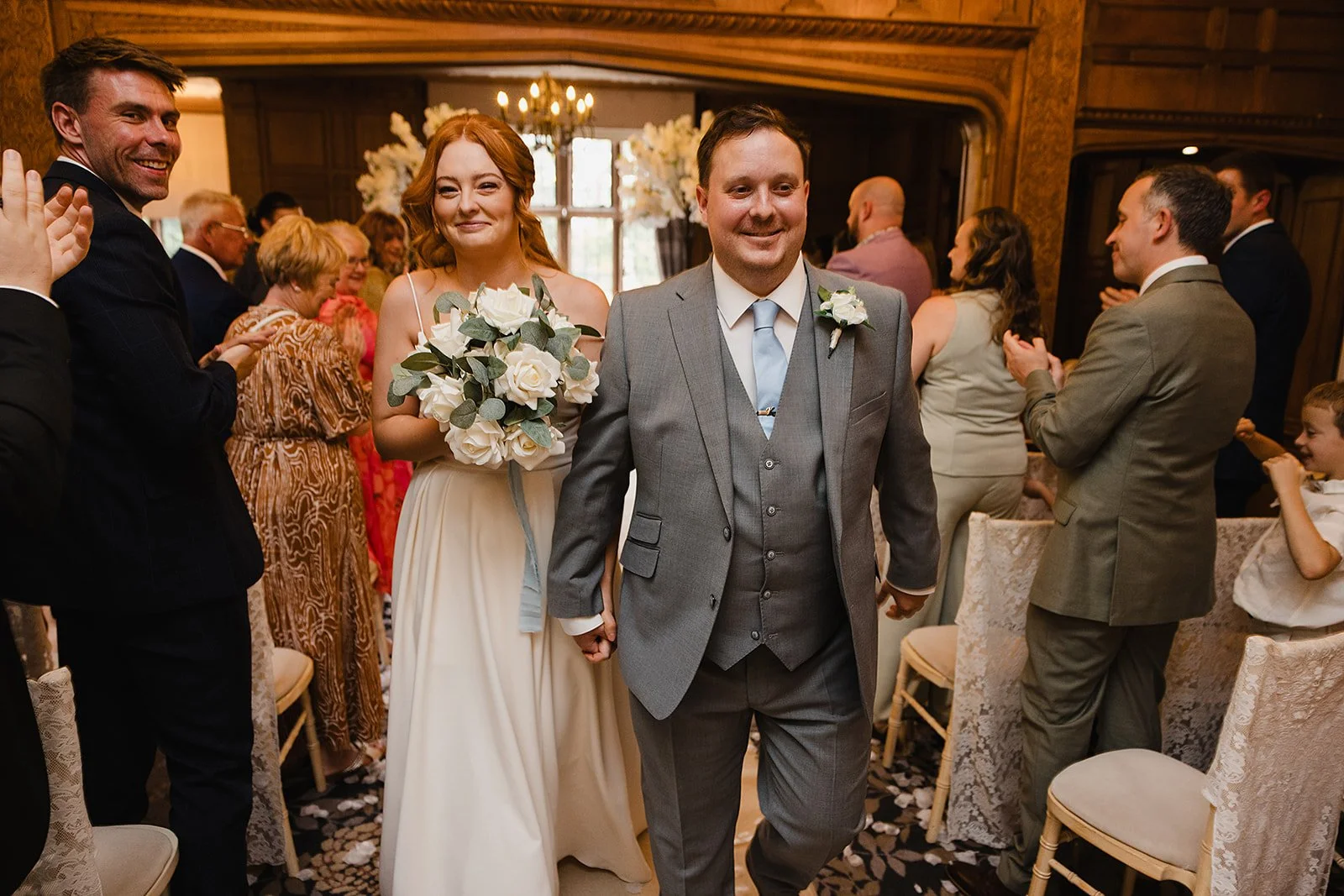 bride-groom-aisle-walk-smiling-inglewood-manor.jpg