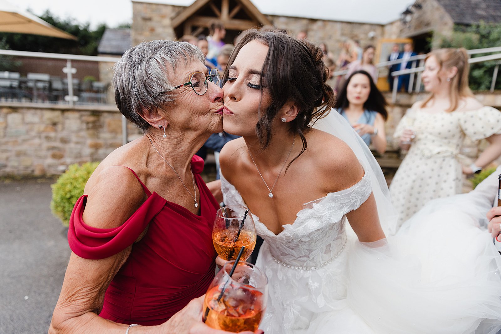 stirk-house-wedding-brides-nan-kissing-bride.jpg