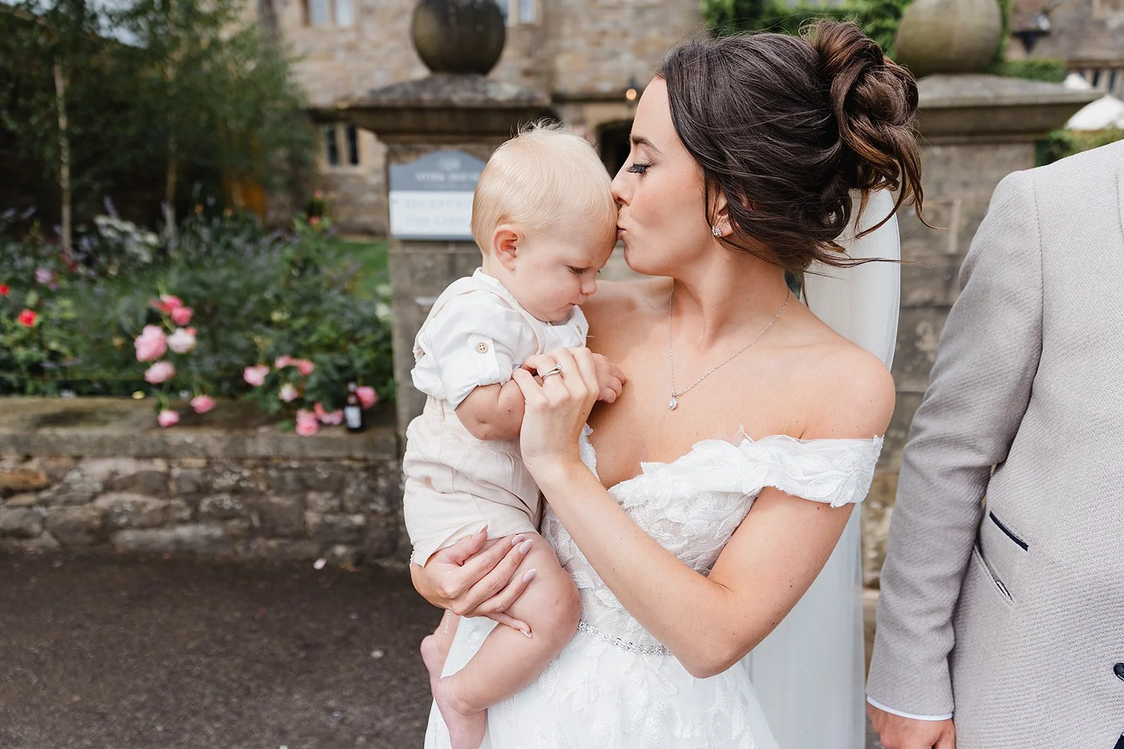 stirk-house-wedding-bride-kissing-baby-gardens.jpg