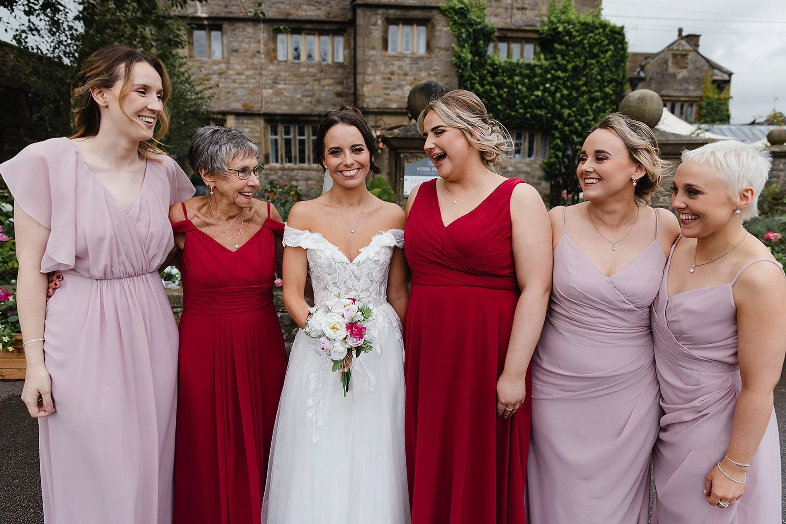 stirk-house-wedding-bride-bridesmaids-group-photo.jpg