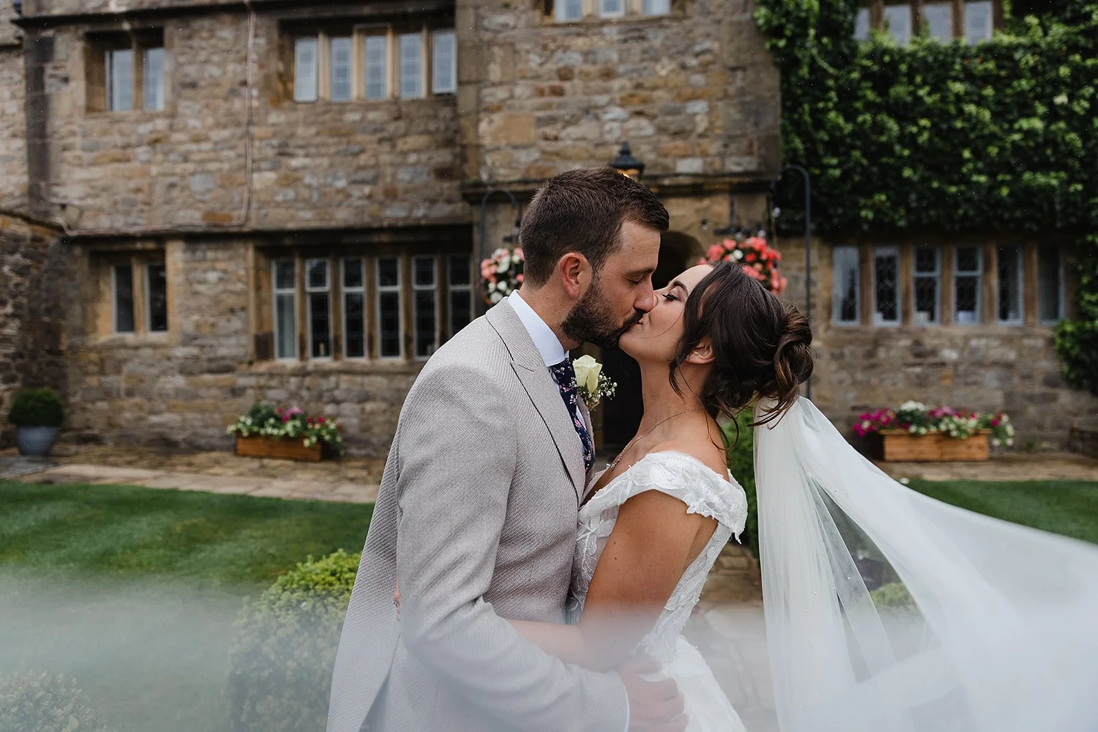 stirk-house-wedding-photographer-couple-kiss-veil-blowing.jpg