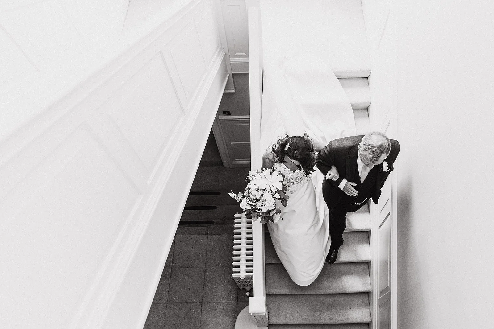 delamere-manor-wedding-bw-bride-father-staircase.jpg