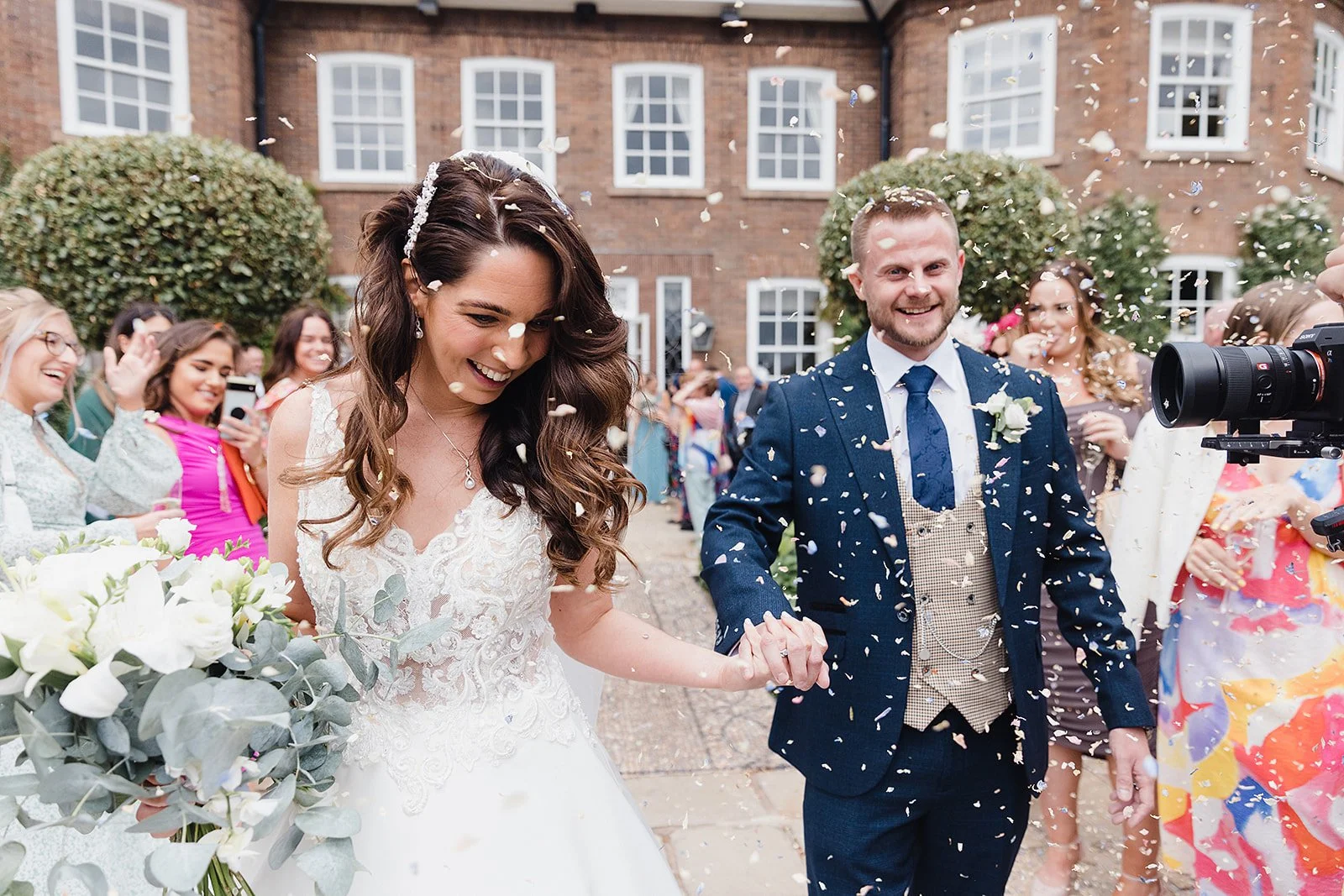 delamere-manor-wedding-confetti-terrace-bride-groom.jpg  