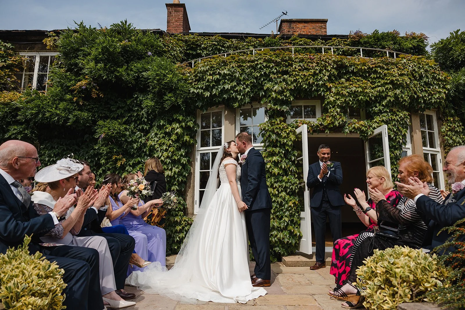 hilltop-country-house-wedding-first-kiss-ivy-terrace.jpg