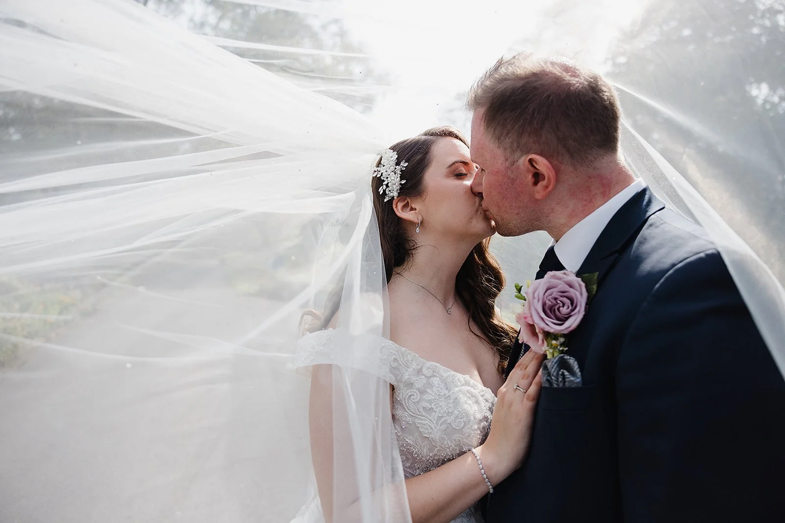 hilltop-country-house-wedding-veil-kiss-portrait.jpg