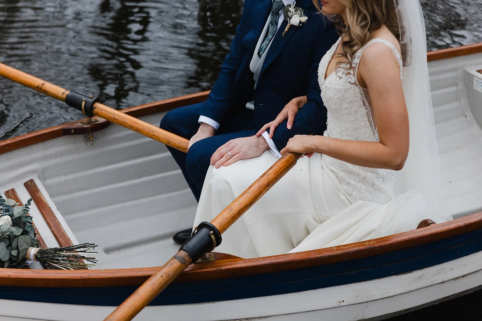 ashes-barns-wedding-rowboat-closeup-linking-arms.jpg