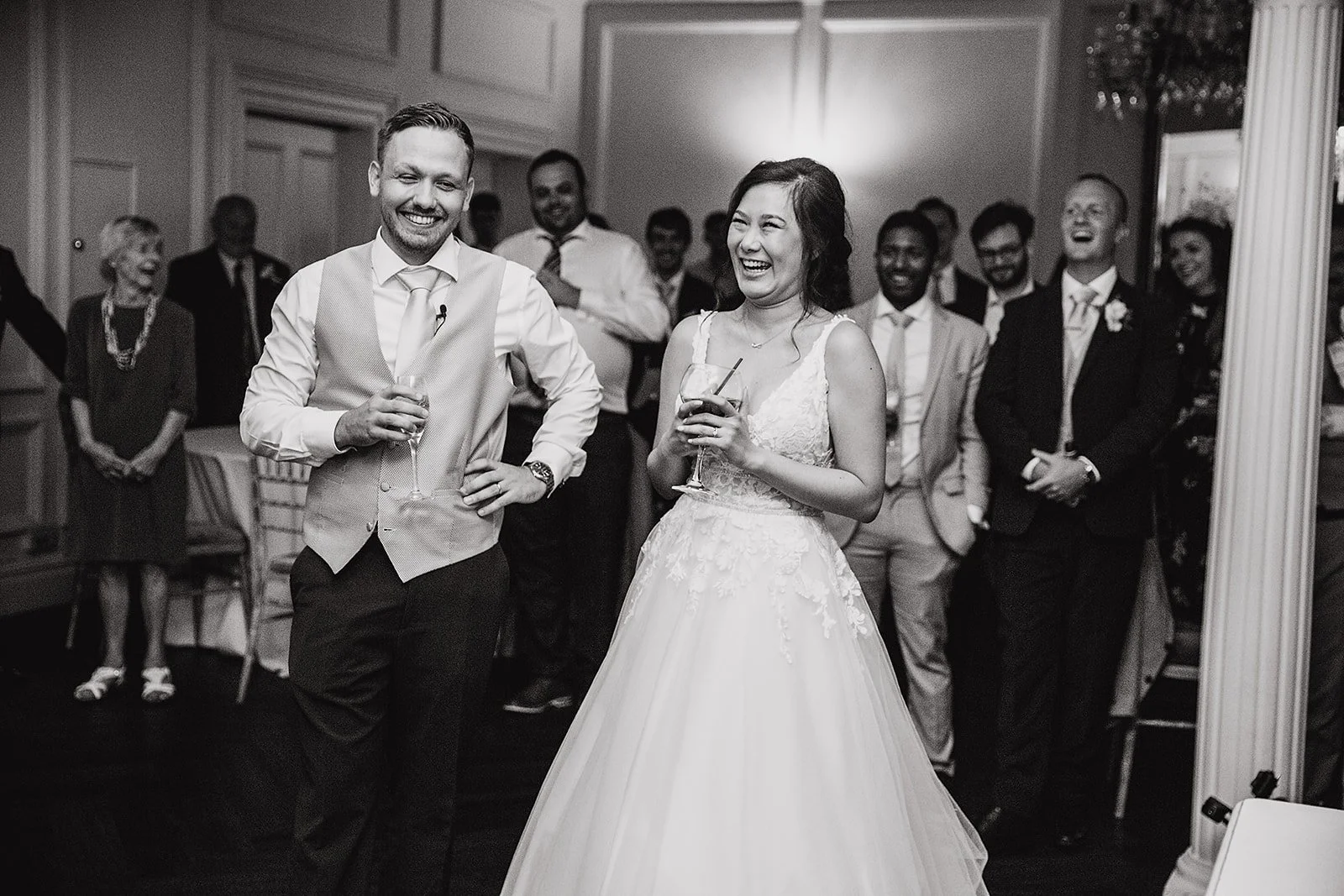 ashfield-house-wedding-bw-bride-groom-laughing-speeches.jpg