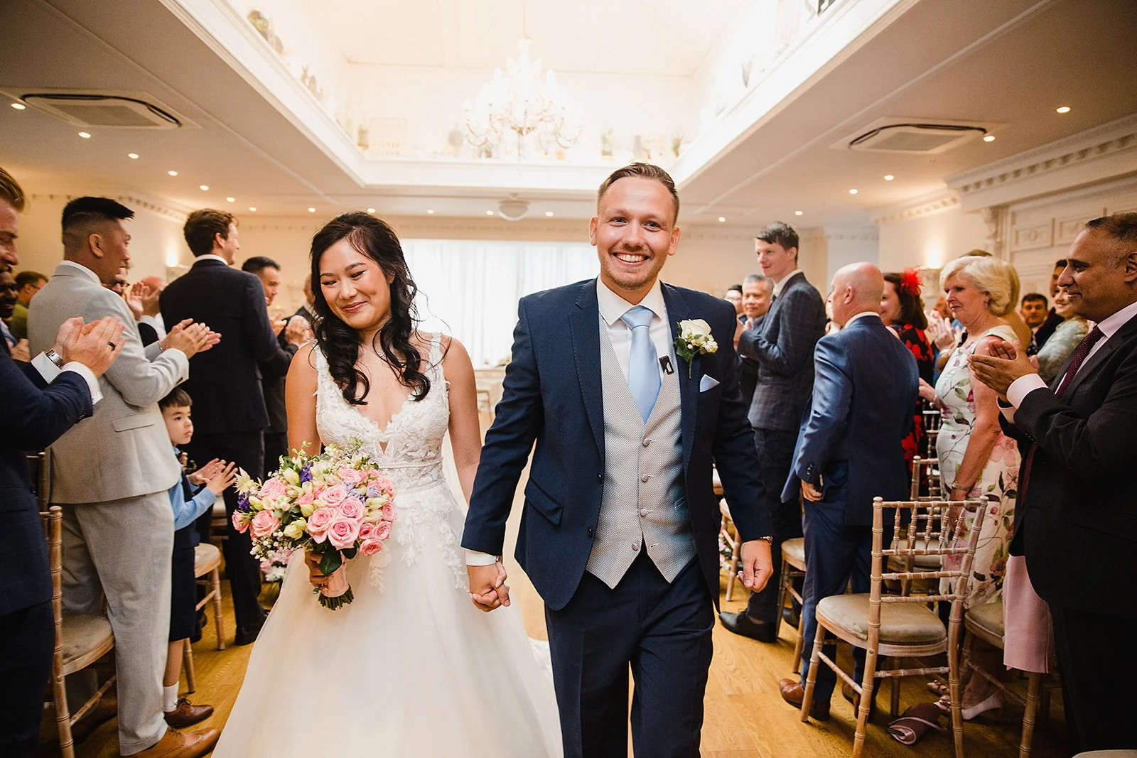 ashfield-house-wedding-aisle-exit-cheering-smiling.jpg