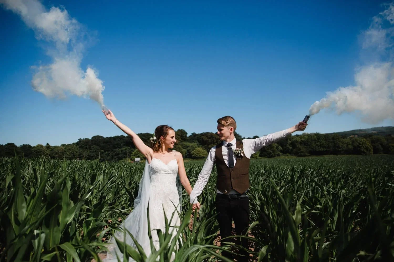 alcumlow-wedding-barn-smoke-flare-portrait-field.jpg