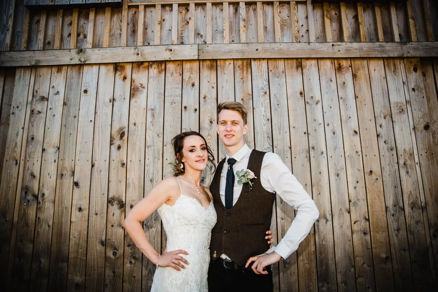 alcumlow-wedding-barn-couple-by-barn-doors.jpg