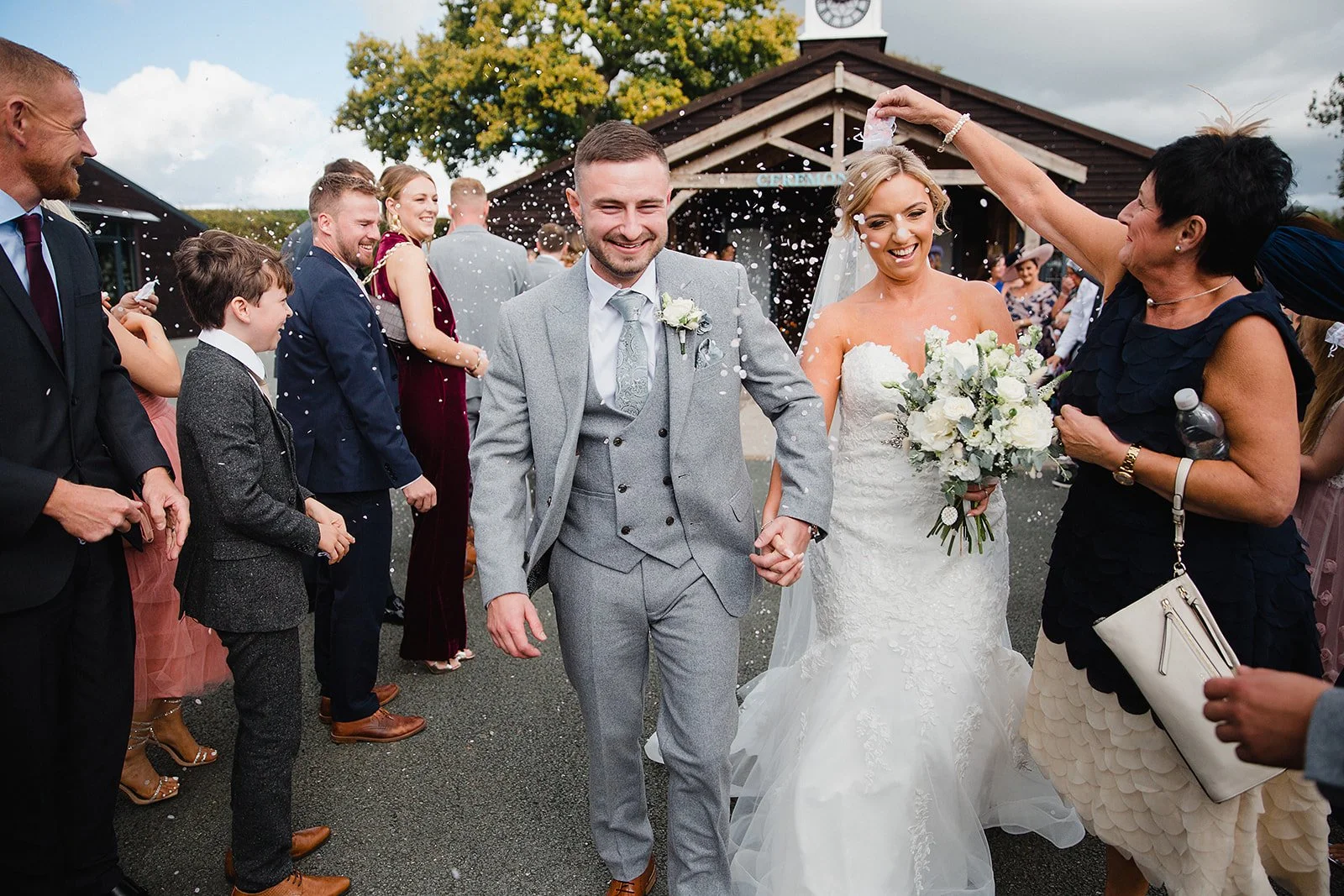 colshaw-hall-confetti-walk-guests-cheering.jpg