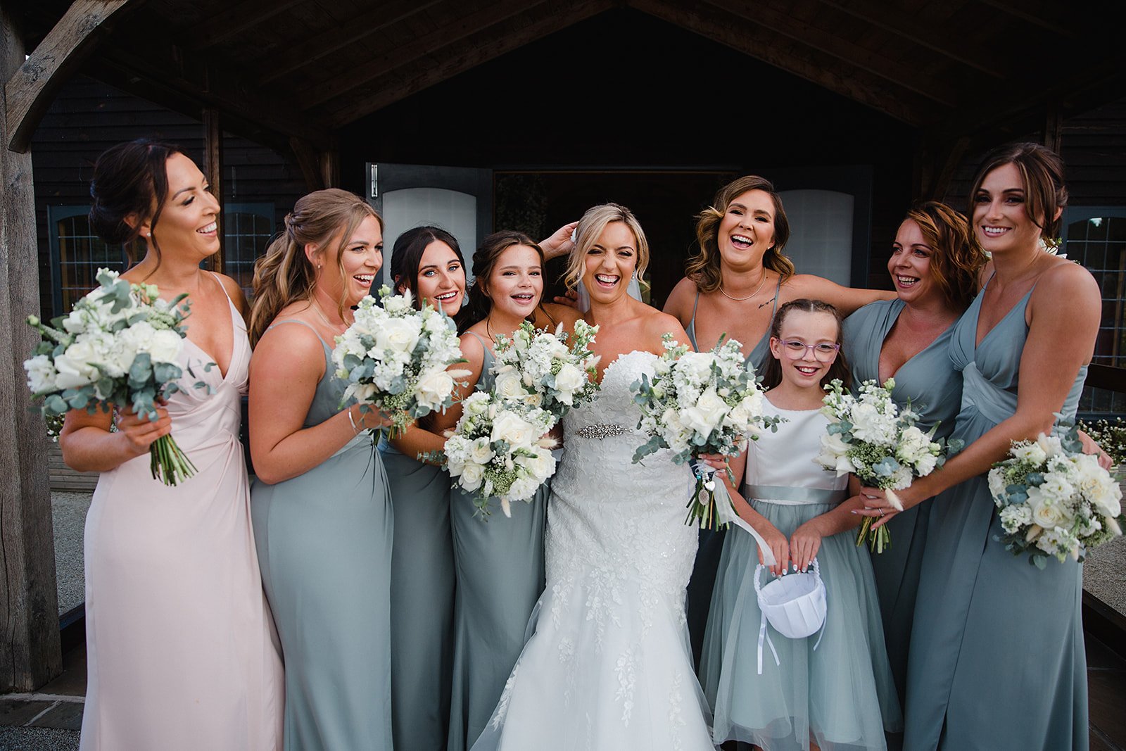 colshaw-hall-bride-bridesmaids-outside-laughing.jpg