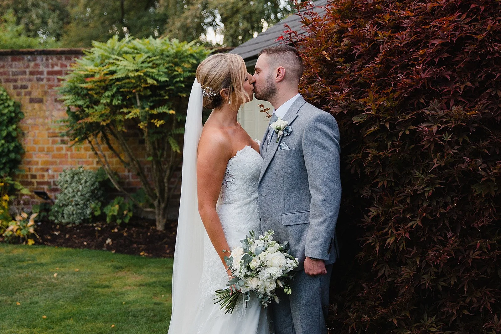 colshaw-hall-wedding-photography-garden-kiss-portrait.jpg