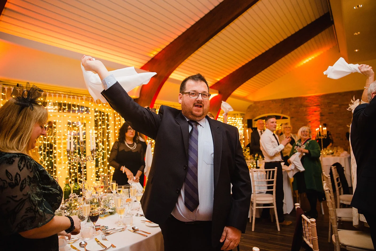 colshaw-hall-wedding-photography-guest-waving-napkin-reception.jpg