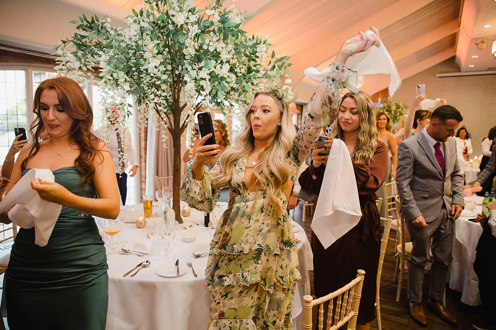 colshaw-hall-wedding-photography-guests-celebrating-napkin-wave.jpg