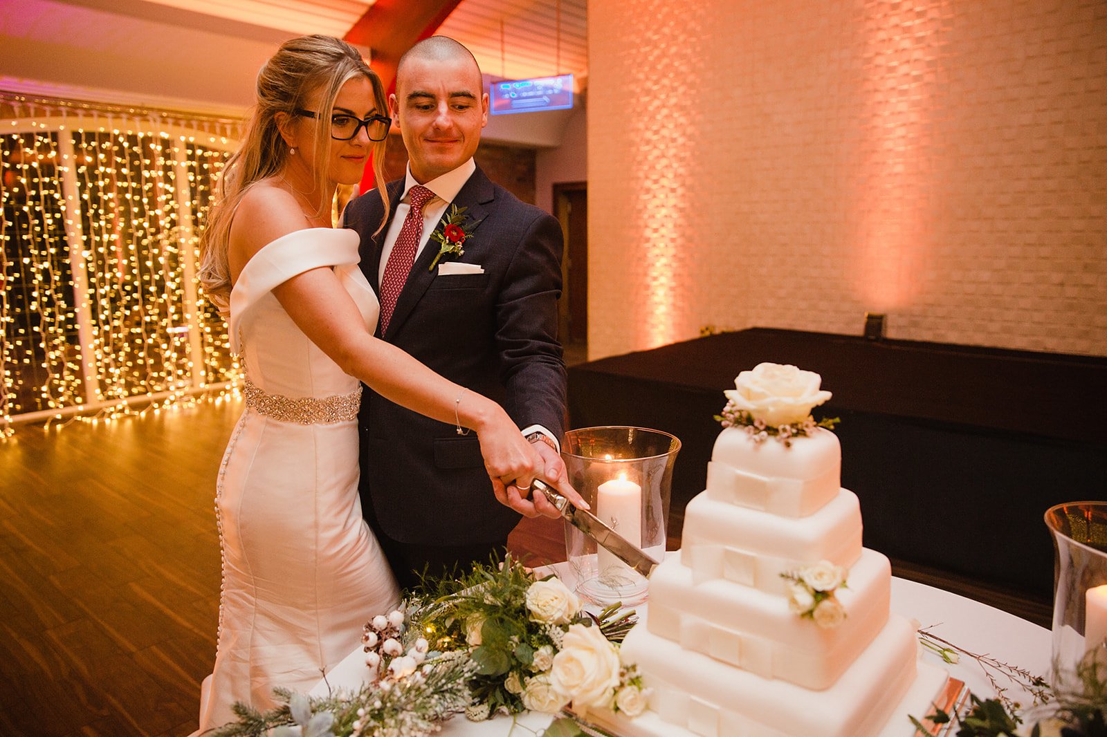 colshaw-hall-wedding-photography-bride-groom-cutting-cake.jpg