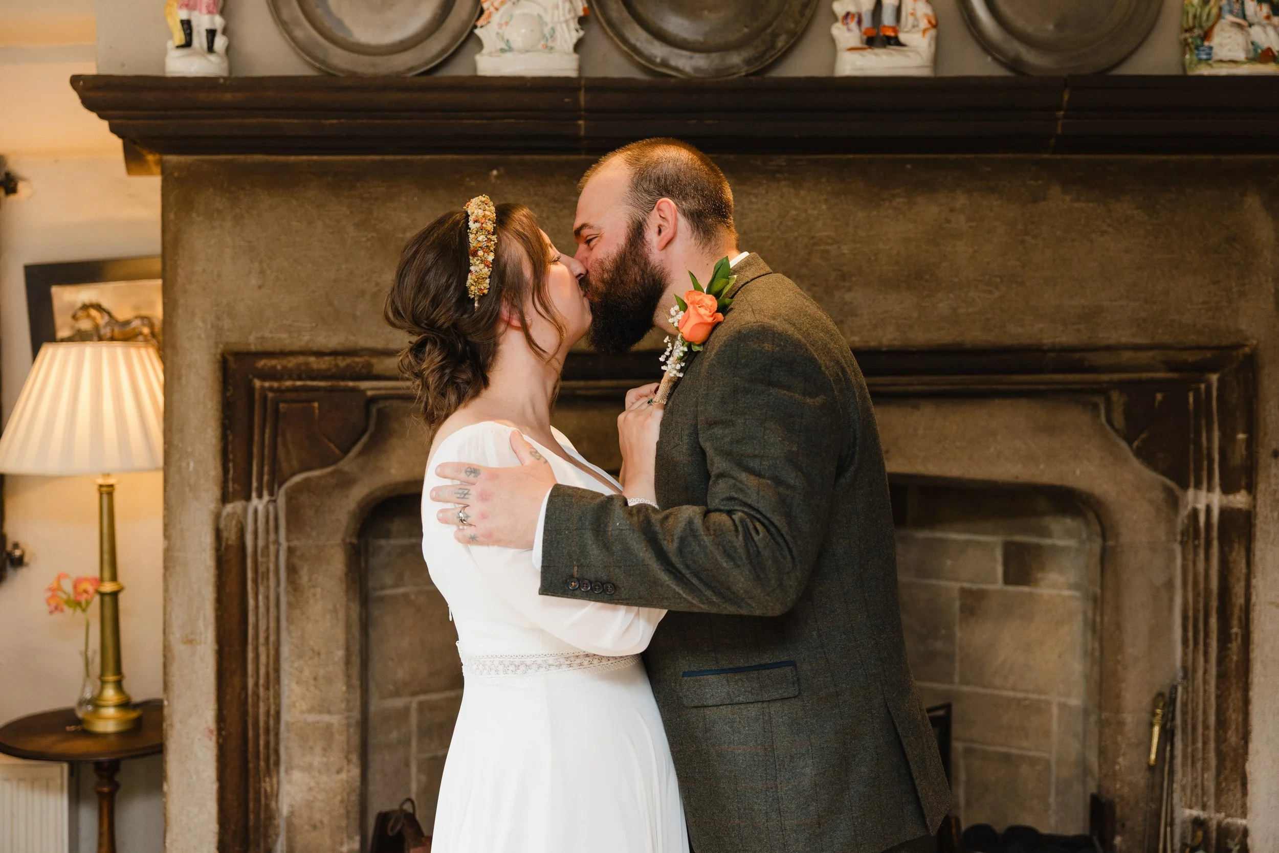steph-and-sam-indoor-kiss-holdsworth-house.jpg