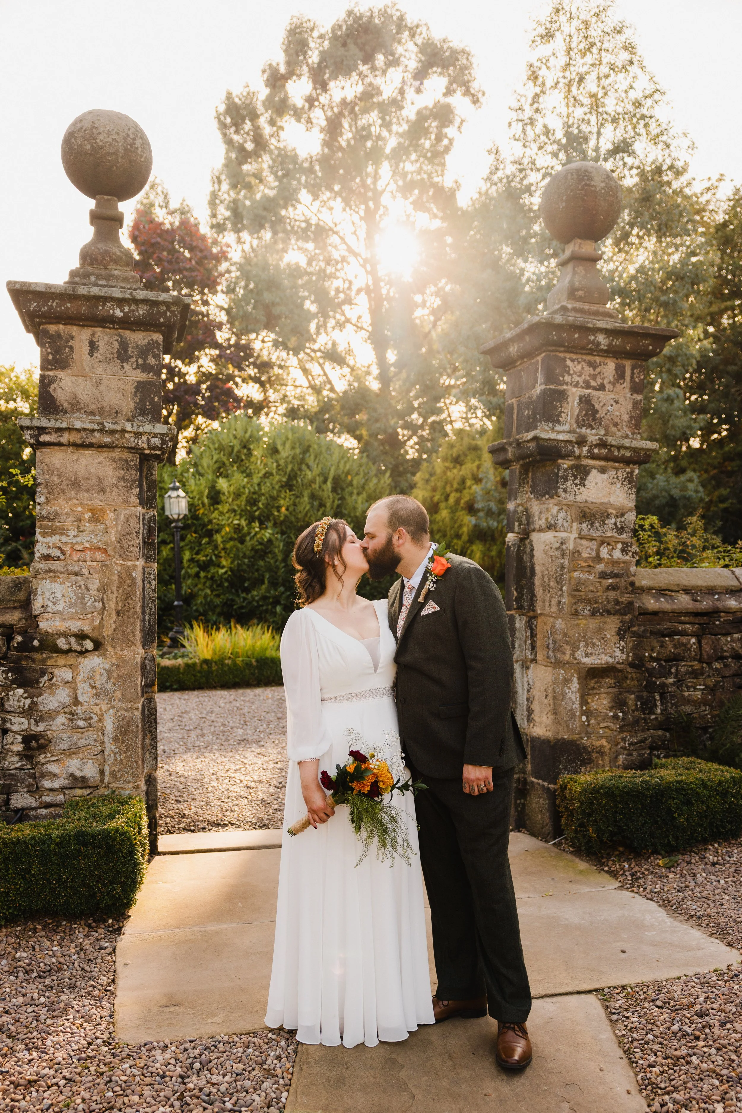steph-and-sam-holdsworth-house-wedding-photography-stone-archway.jpg