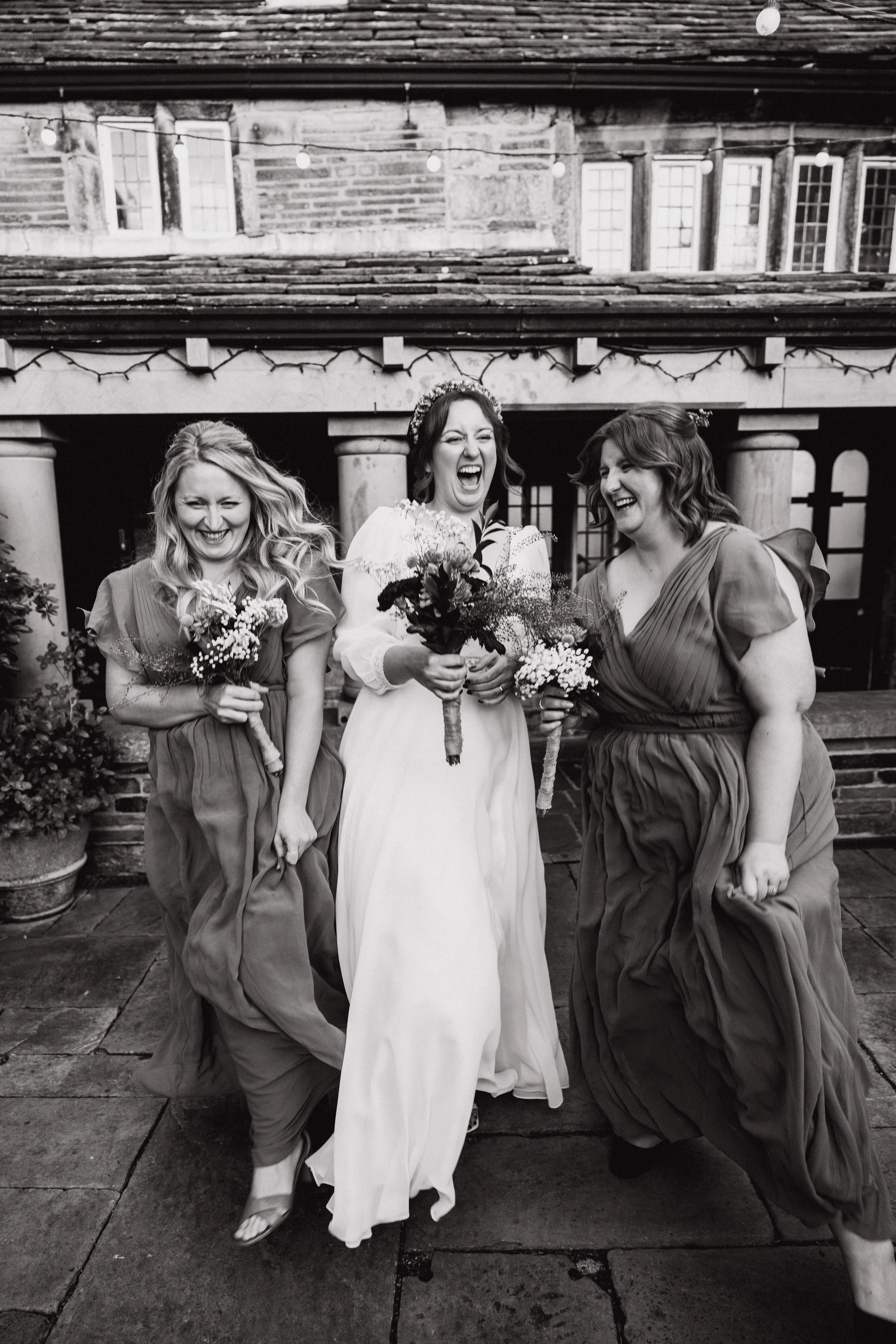 steph-and-bridesmaids-black-and-white-holdsworth-house.jpg