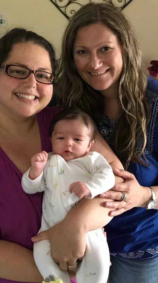 Odessa Bates with a client and her baby
