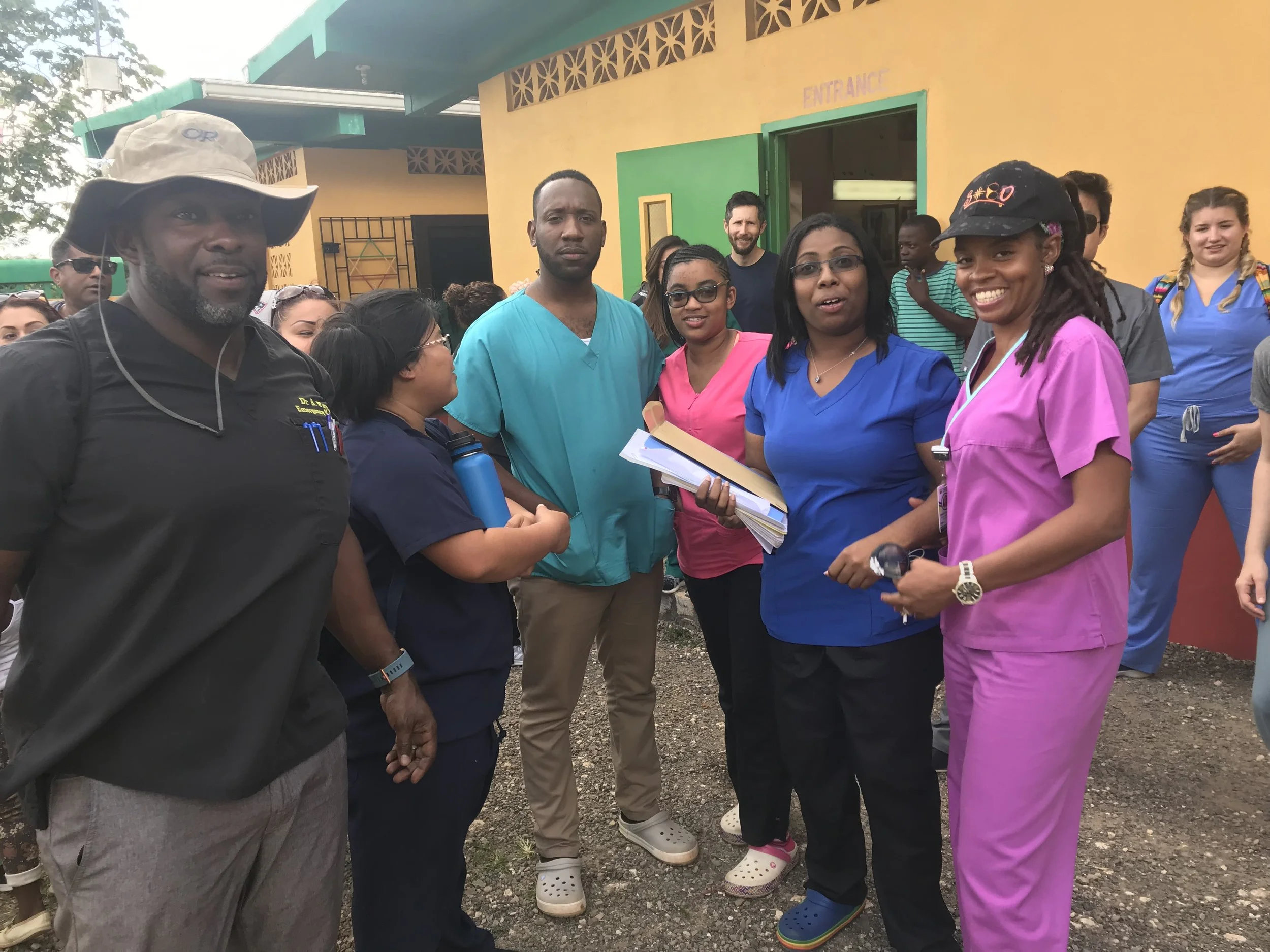Team members with local Jamaican medical students who joined our health fair at Nine Mile.