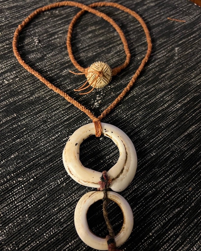  Handmade cord and Conus shells 