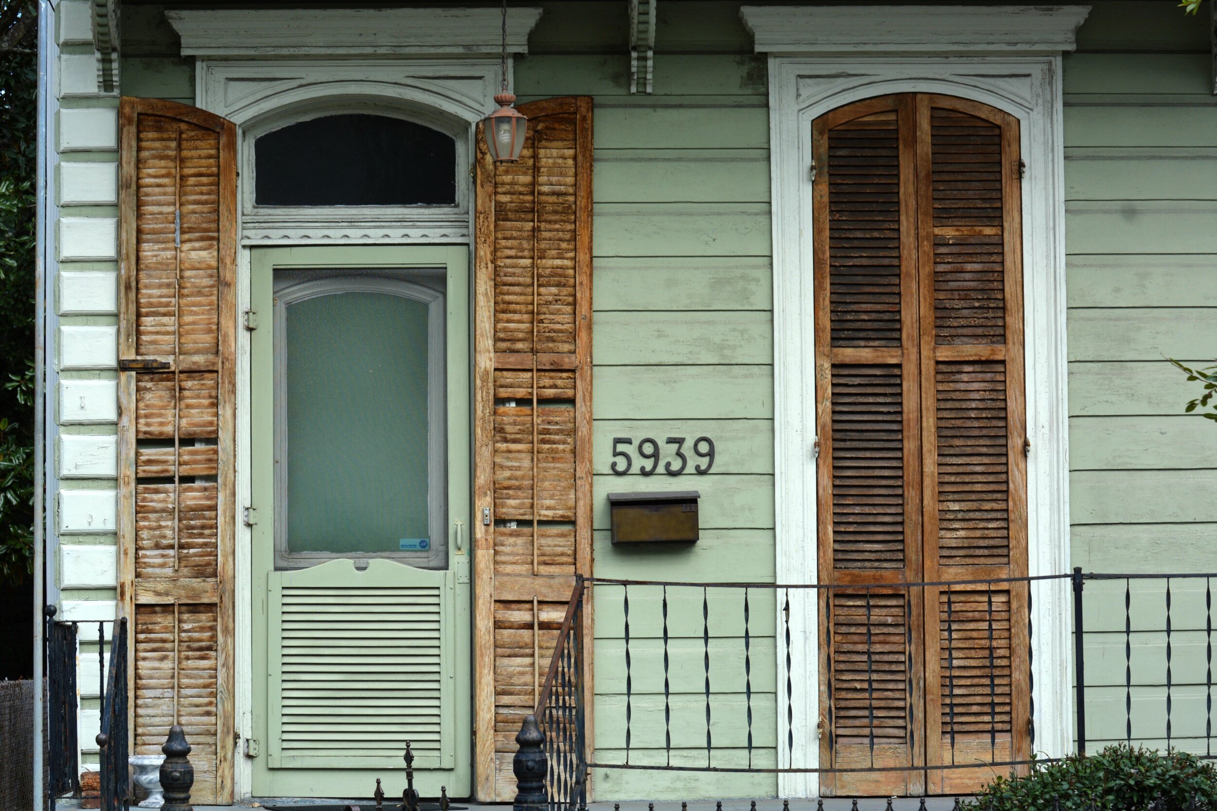 New Orleans - Mint Green House Brown Distressed Shutters.jpg